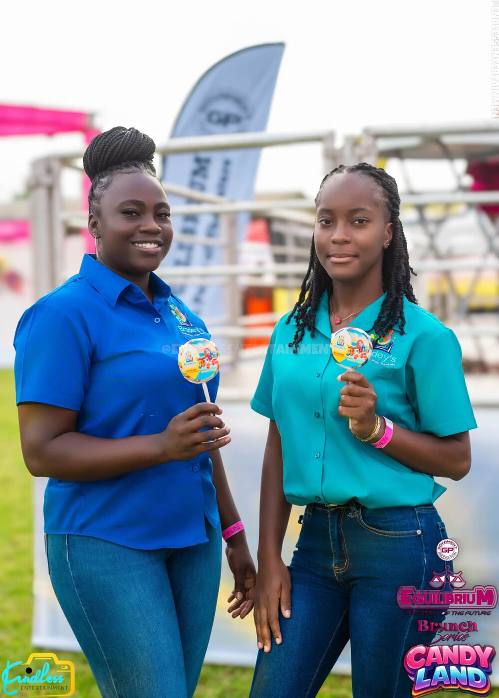 Two Bradey’s team members holding treats at an outdoor event