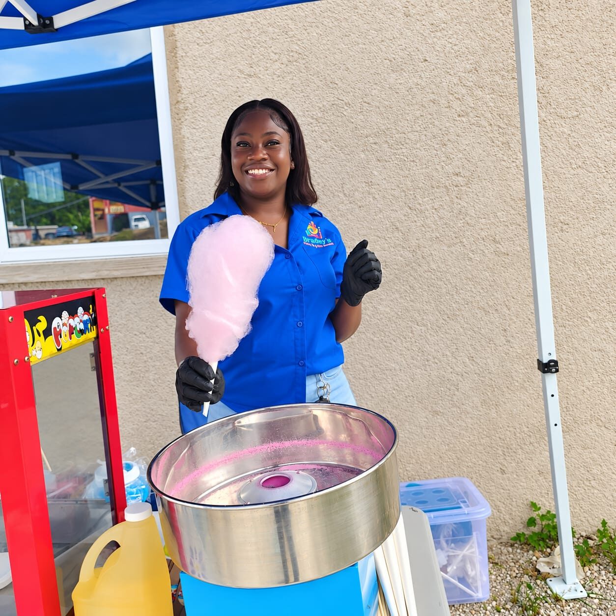 Bradey’s team member serving cotton candy