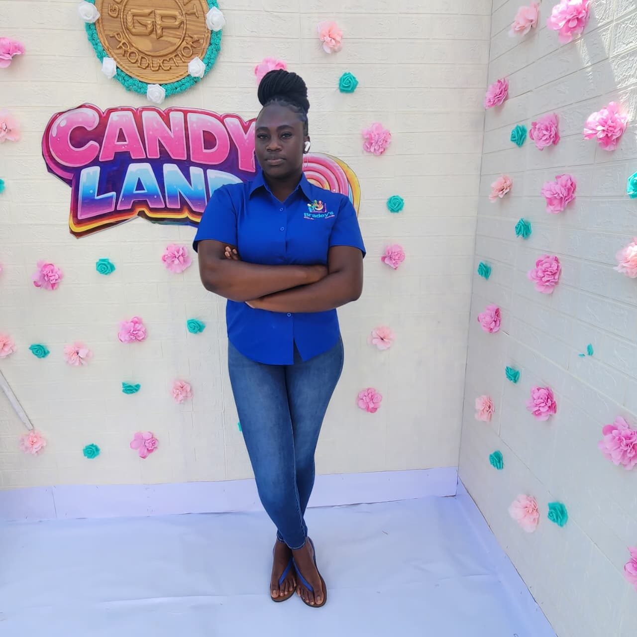 Team member at a Candy Land themed event backdrop